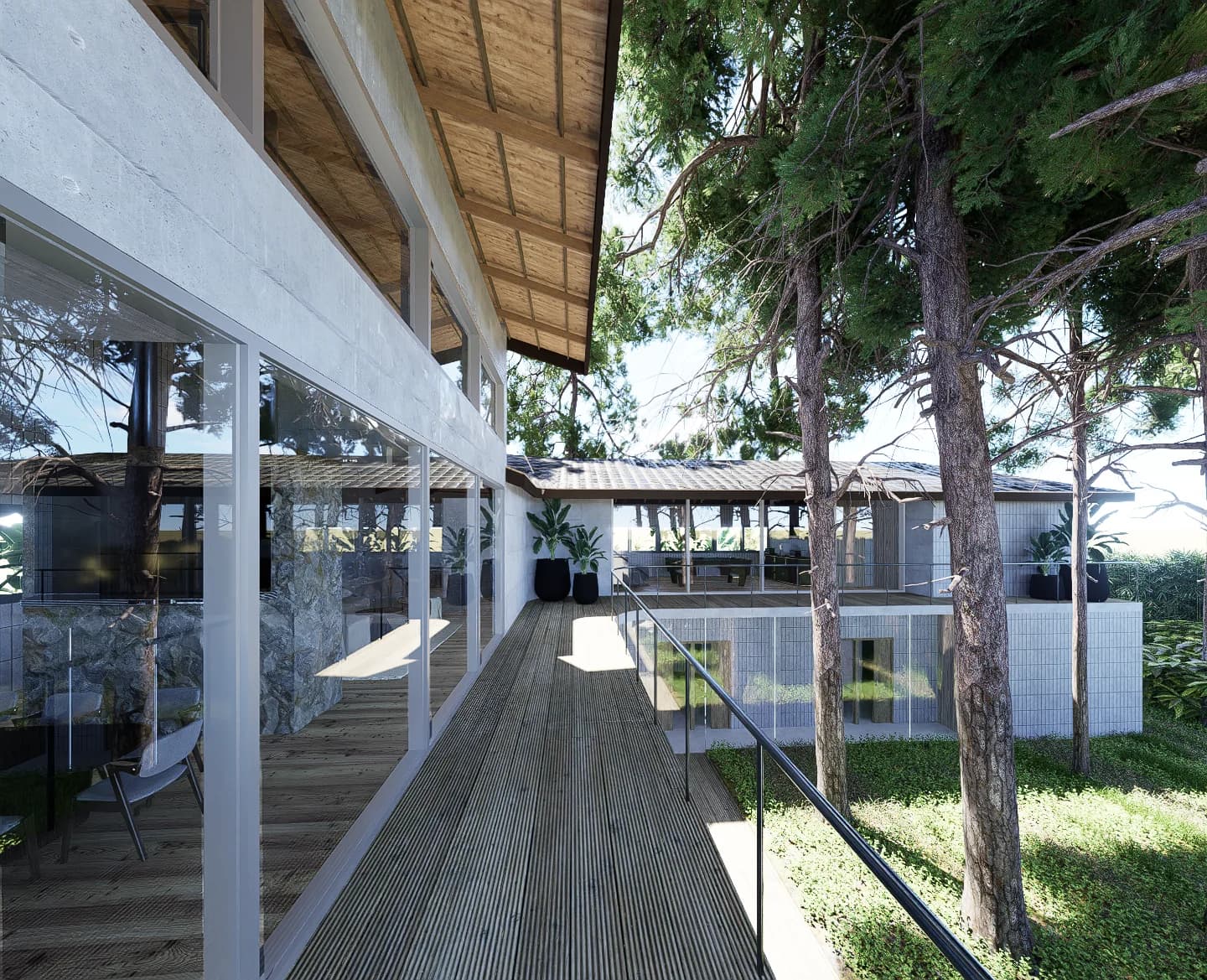 Galería elevada de madera en la planta alta, entre los pinos